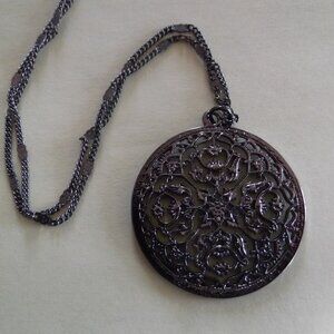 Lovely intricate black circular pendant necklace
